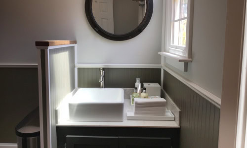 Premium vanity with vessel sinks in luxury restroom