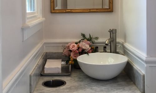 Interior of 12-foot luxury restroom with vanity and mirror